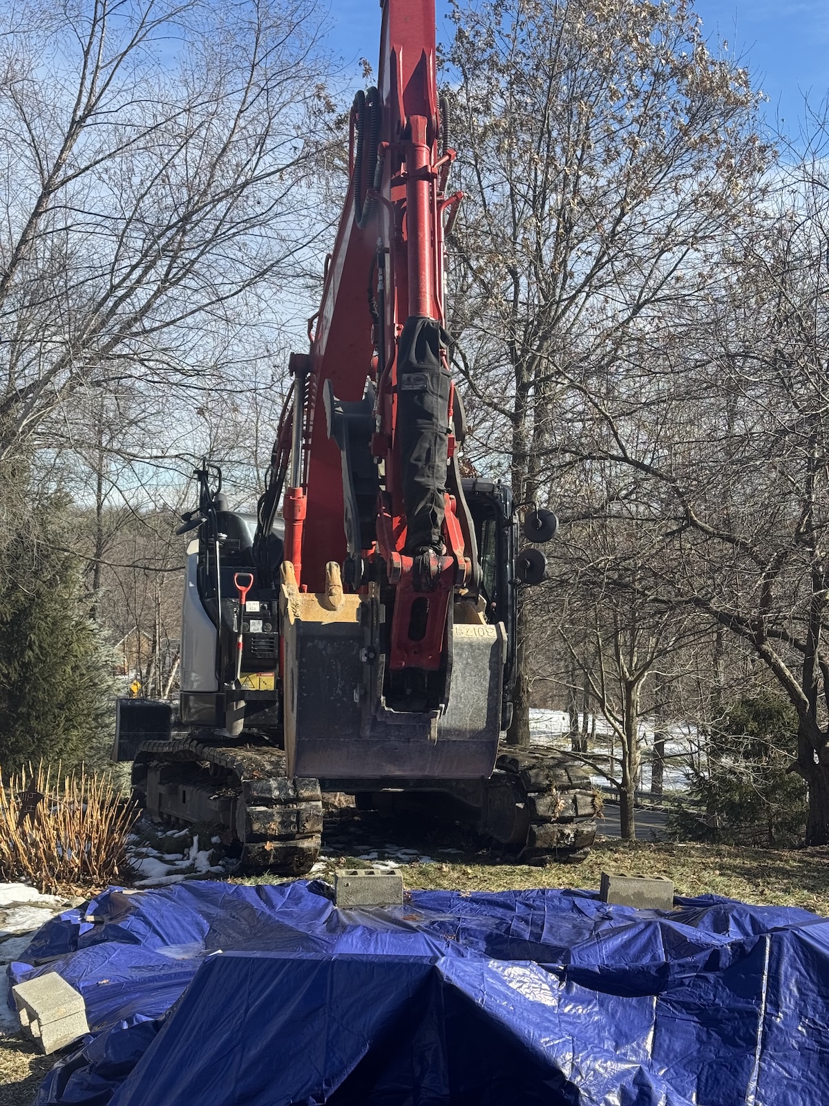 Excavator in our yard.